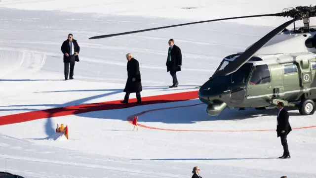 President Donald Trump walks out of the Marine One helicopter as he arrives for the 56th annual meeting of the World Economic Forum (WEF) in Davos, Switzerland