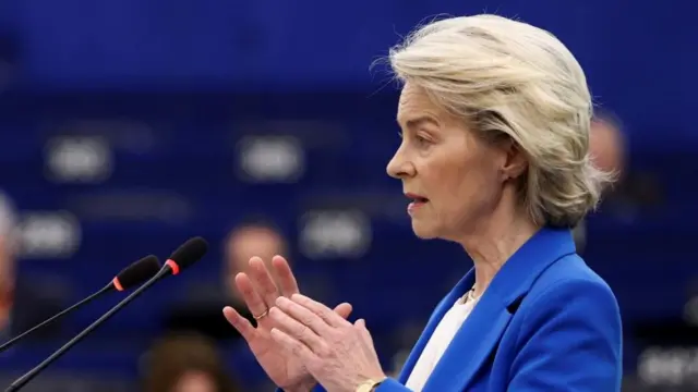 Ursula von der Leyen speaking at a podium