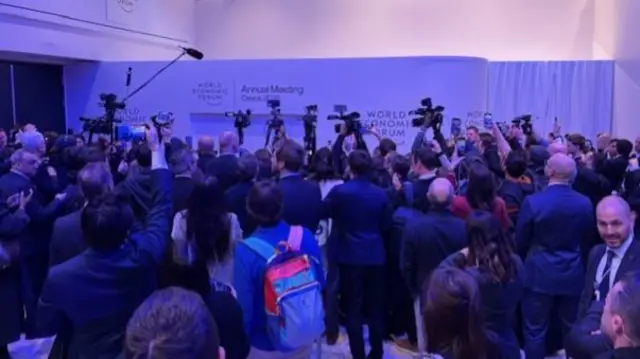 Press gathered at World Economic Forum.