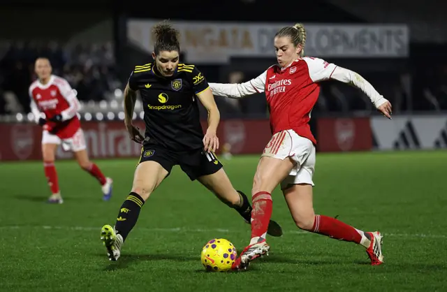 Alessia Russo of Arsenal is challenged