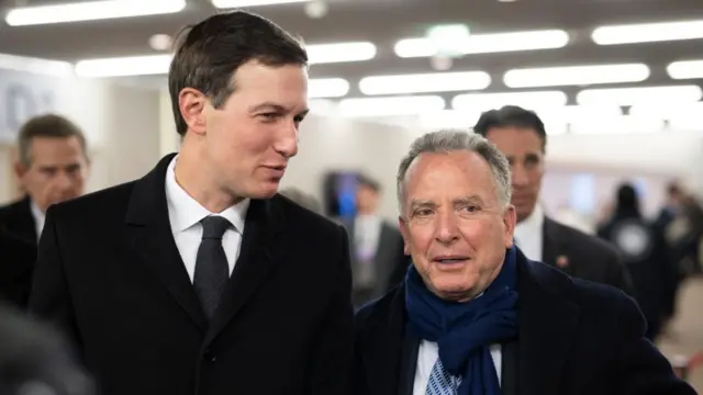 Jared Kushner and Steve Witkoff pictured at Davos. in front of a blurred background