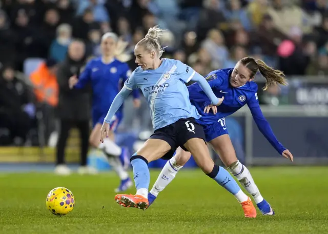 Manchester City's Alex Greenwood and Chelsea's Wieke Kaptein battle for the ball