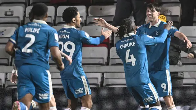 Burton celebrate scoring
