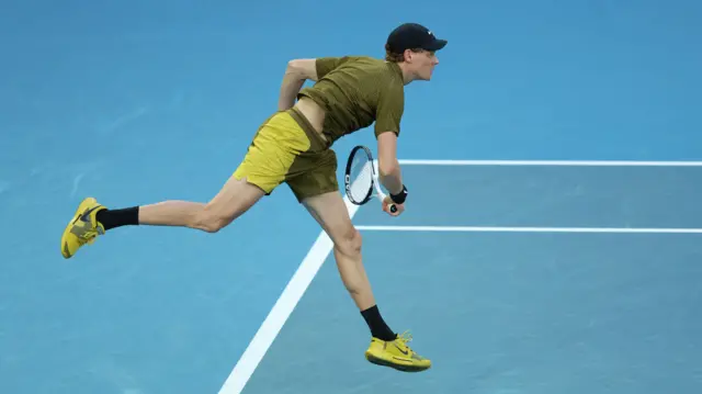 Jannik Sinner serves