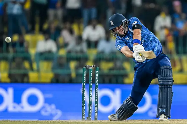 England's Jamie Overton plays a shot during the first one-day international
