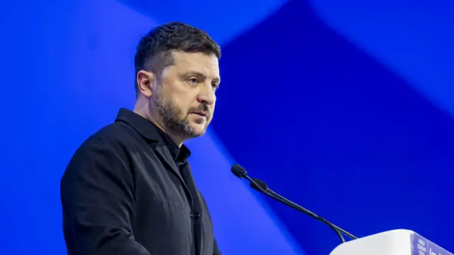 Zelensky speaking at a podium in Davos