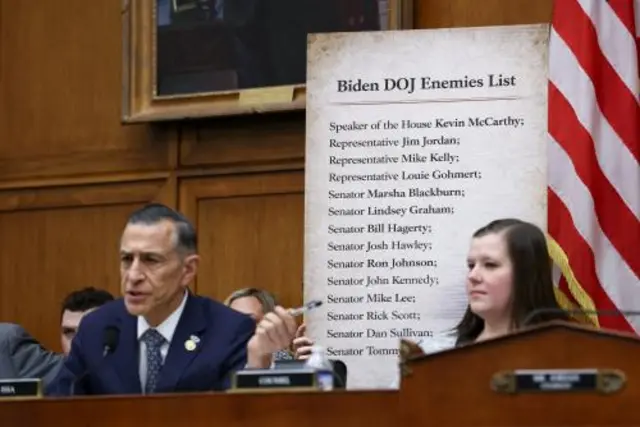 U.S. Representative Darrell Issa (R-CA) speaks, as an alleged 'Biden DOJ Enemies List' is held up