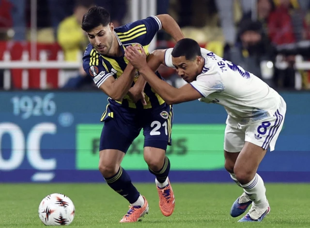 Aston Villa's Youri Tielemans in action with Fenerbahce's Marco Asensio