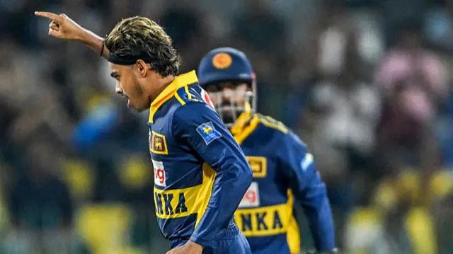 Sri Lanka's Dunith Wellalage celebrates after taking the wicket of England's Jacob Bethell