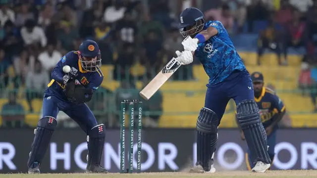 Rehan Ahmed of England playing a shot d