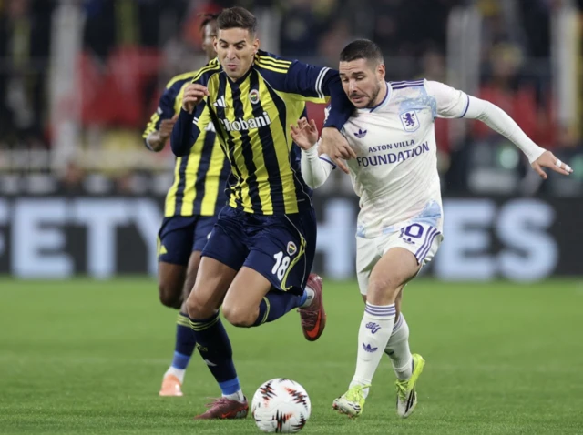 Aston Villa's Emiliano Buendia in action with Fenerbahce's Mert Muldur