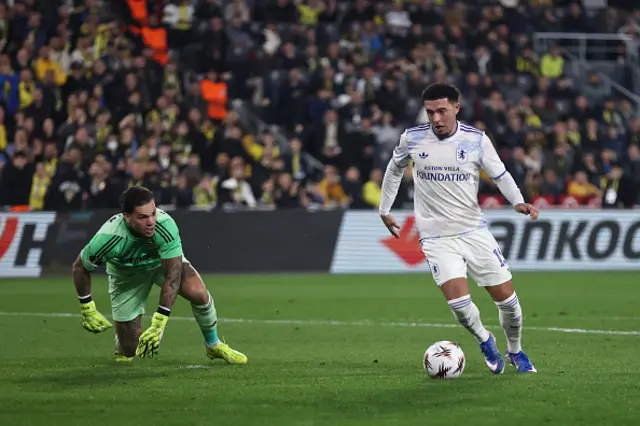 Jadon Sancho of Aston Villa takes on Ederson