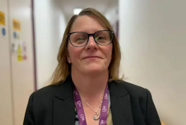 Chief executive officer Renée Padfield wearing black suit