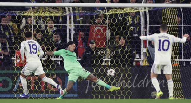 Aston Villa's Jadon Sancho scores their first goal as Fenerbahce's Ederson attempts to make a save