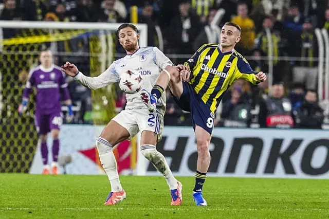 Kerem Akturkoglu of Fenerbahce in action against Matty Cash (L) of Aston Villa