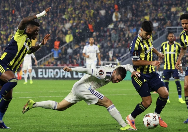 Aston Villa's Emiliano Buendia in action with Fenerbahce's Marco Asensio and Nelson Semedo