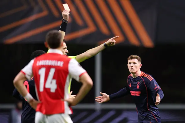 Referee Igor Pajac shows a red card to Elliot Anderson of Nottingham Forest