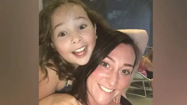 Milly Main hugs Kimberly Darroch, both are smiling