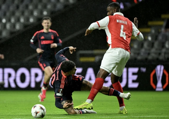 Sporting Braga's Sikou Niakate (right) fouls Nottingham Forest's Morgan Gibbs-White