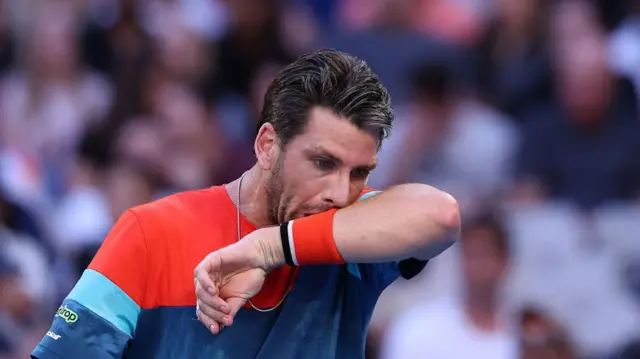 Cameron Norrie reacts