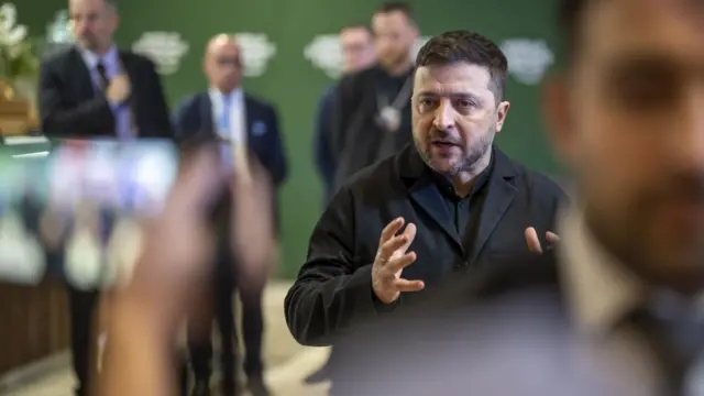 Ukraine's President Volodymyr Zelenskyy (R), answers journalists questions during the 56th annual meeting of the World Economic Forum (WEF), in Davos, Switzerland