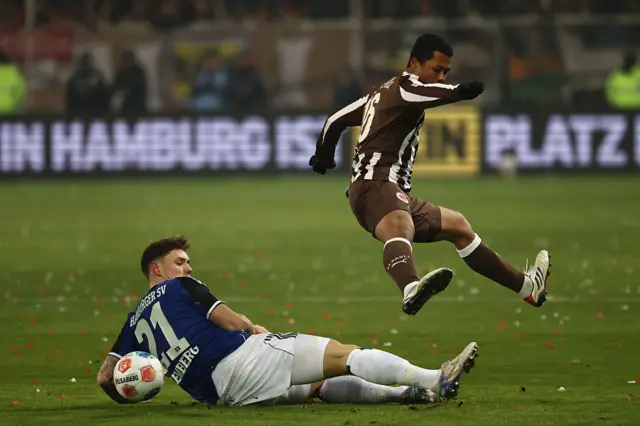 Hamburg's German midfielder #21 Nicolai Remberg and St Pauli's Japanese midfielder #16 Joel Chima Fujita