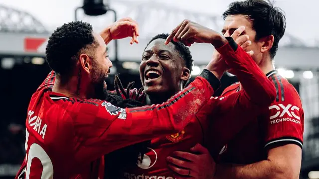 Kobbie Mainoo celebrates