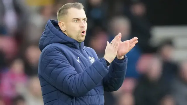 Southampton boss Tonda Eckert applauding his players from the touchline