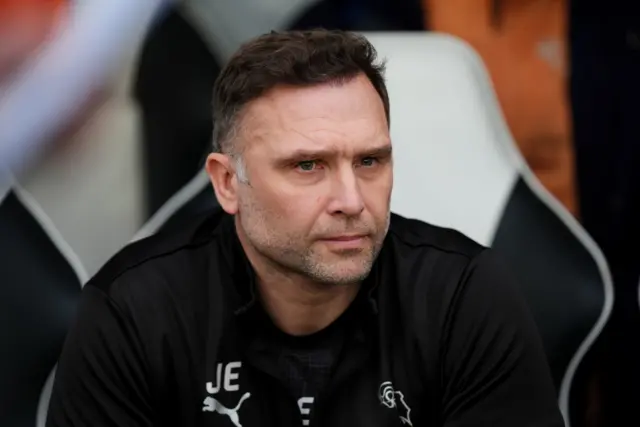 Derby head coach John Eustace sat in the dugout at Pride Park