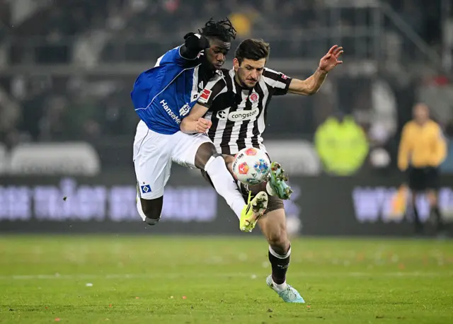 Fabio Balde of Hamburger SV battles for possession with Adam Dzwigala of FC St. Pauli