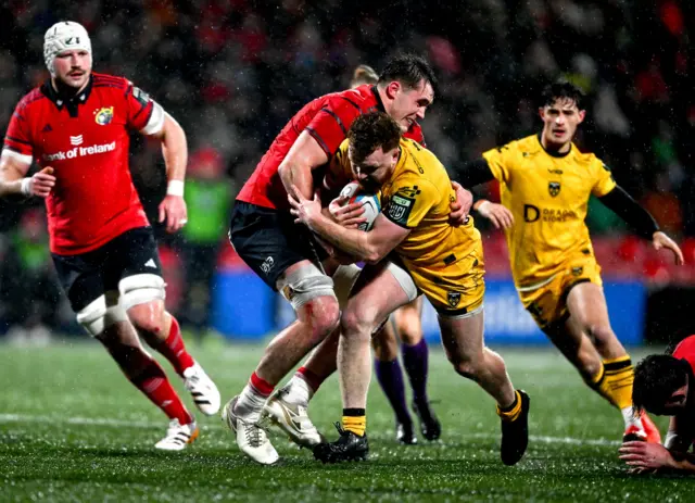 Aneurin Owen of Dragons in action against Brian Gleeson of Munster