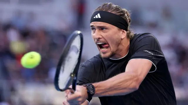 Alexander Zverev hits a backhand