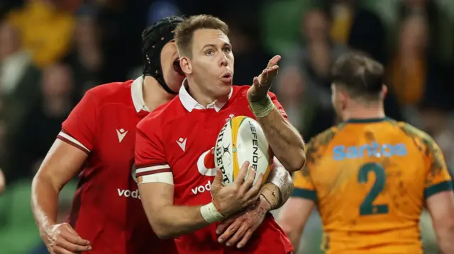 Liam Williams of Wales celebrates scoring a try