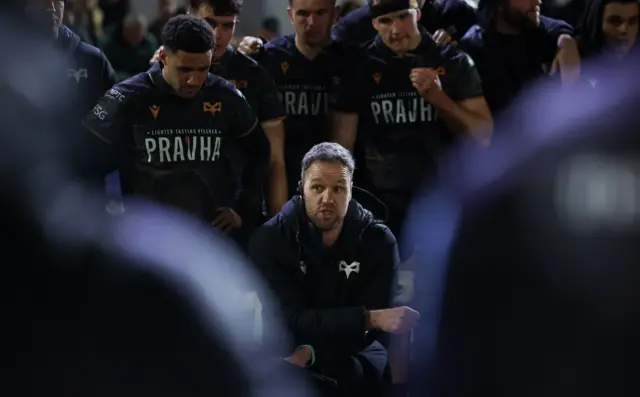 Mark Jones amid an Ospreys huddle