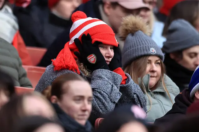 Arsenal fan looks glum in the stands at the Emirates