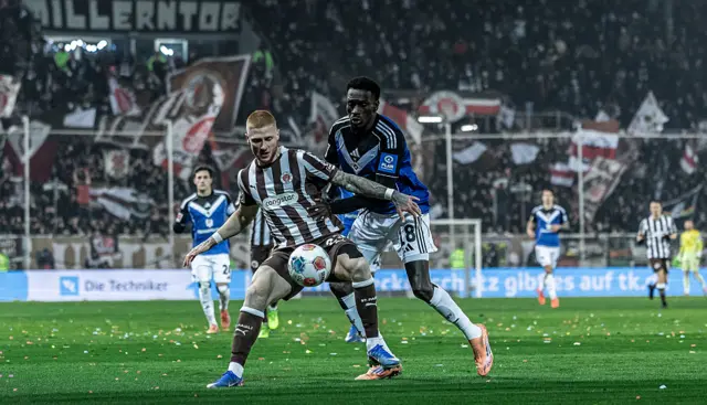 Bakery Jatta of Hamburger SV in action with Louis Oppie of FC St. Pauli