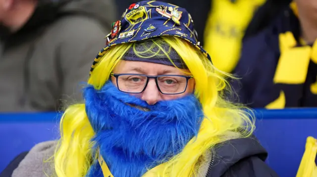 Oxford fan in a fake blue beard