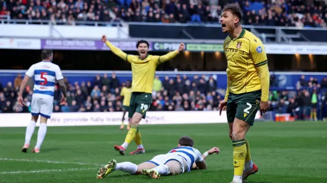 Wrexham's Callum Doyle celebrating his goal at QPR