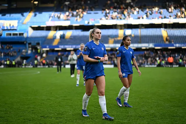 Chelsea players applaud fans at Stamford Bridge