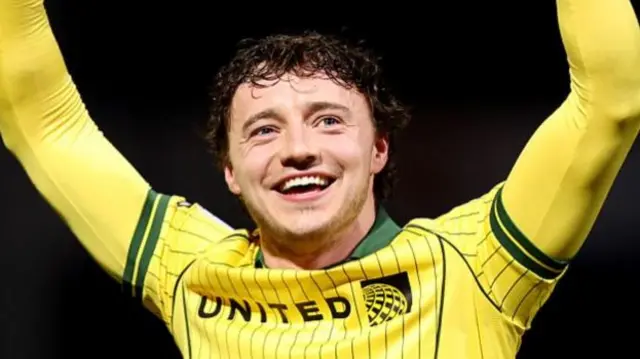 Ollie Rathbone of Wrexham celebrates victory at full-time following the between Queens Park Rangers and Wrexham