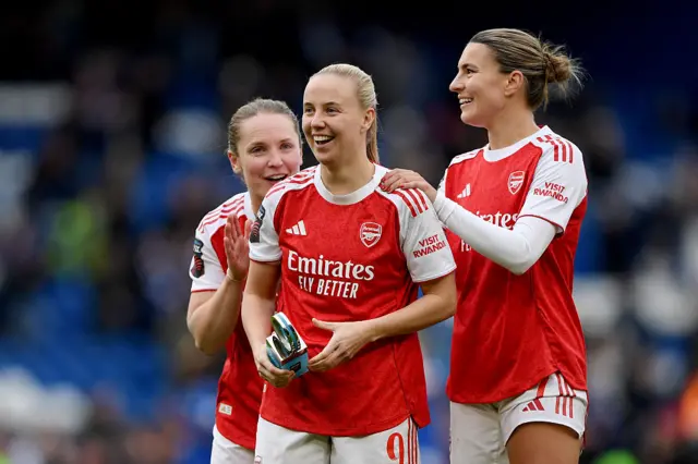 Beth Mead celebrates with teammates holding the POTM trophy