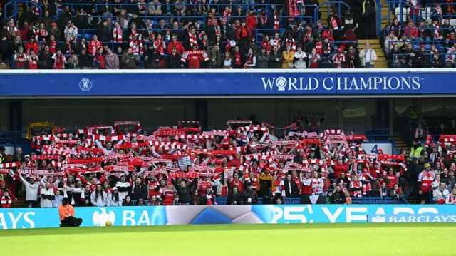 Arsenal fans show their support in the away end