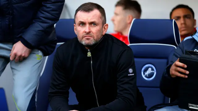 Charlton boss Nathan Jones in the dugout at Millwall