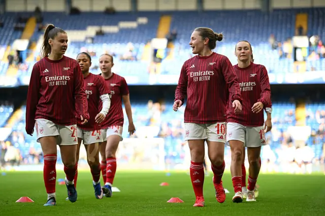 Victoria Pelova and Kim Little warm up at Stamford Bridge