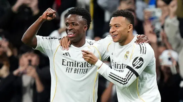 Vini Jr celebrates with Kylian Mbappe