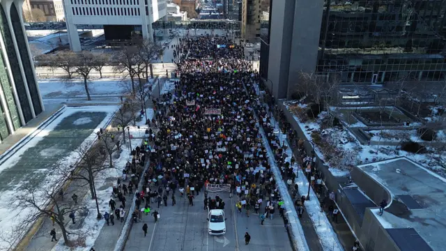 Protesters gather with placards in downtown Minneapolis