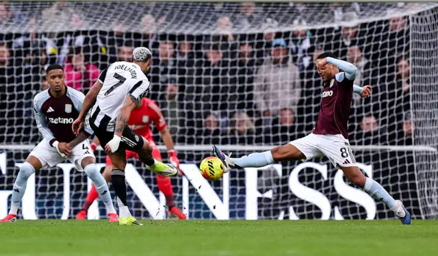 Newcastle United's Joelinton shot is blocked by Aston Villa's Youri Tielemans