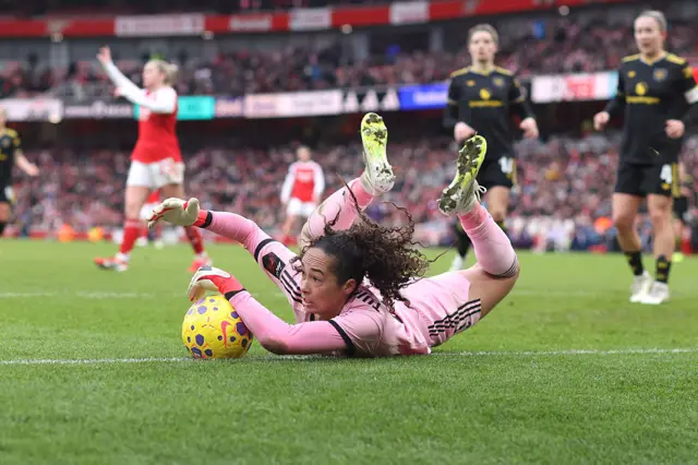 Phallon Tullis-Joyce makes a save for Manchester United versus Arsenal