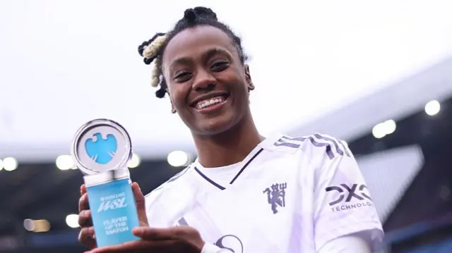 Melvine Malard with her player of the match trophy