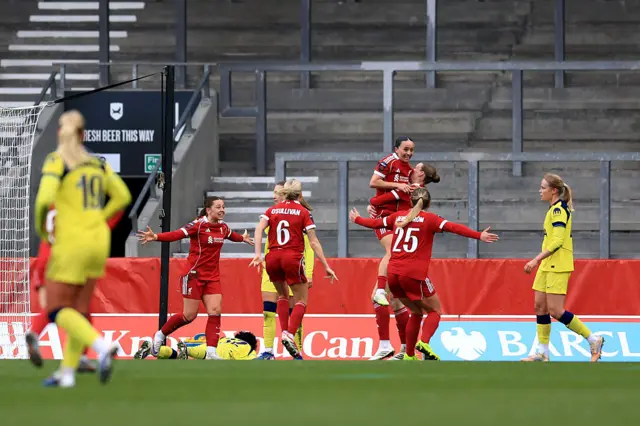 Mia Enderby celebrates with her teammates